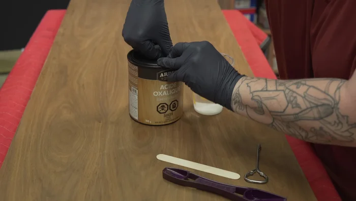 Lightly sand the tabletop.