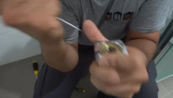 Clean any remaining residue or gunk from the shower head components.