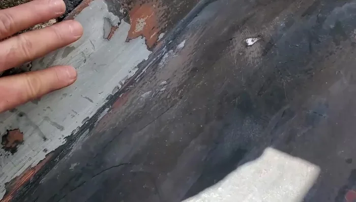 Apply a top coat of paint to match the existing door.