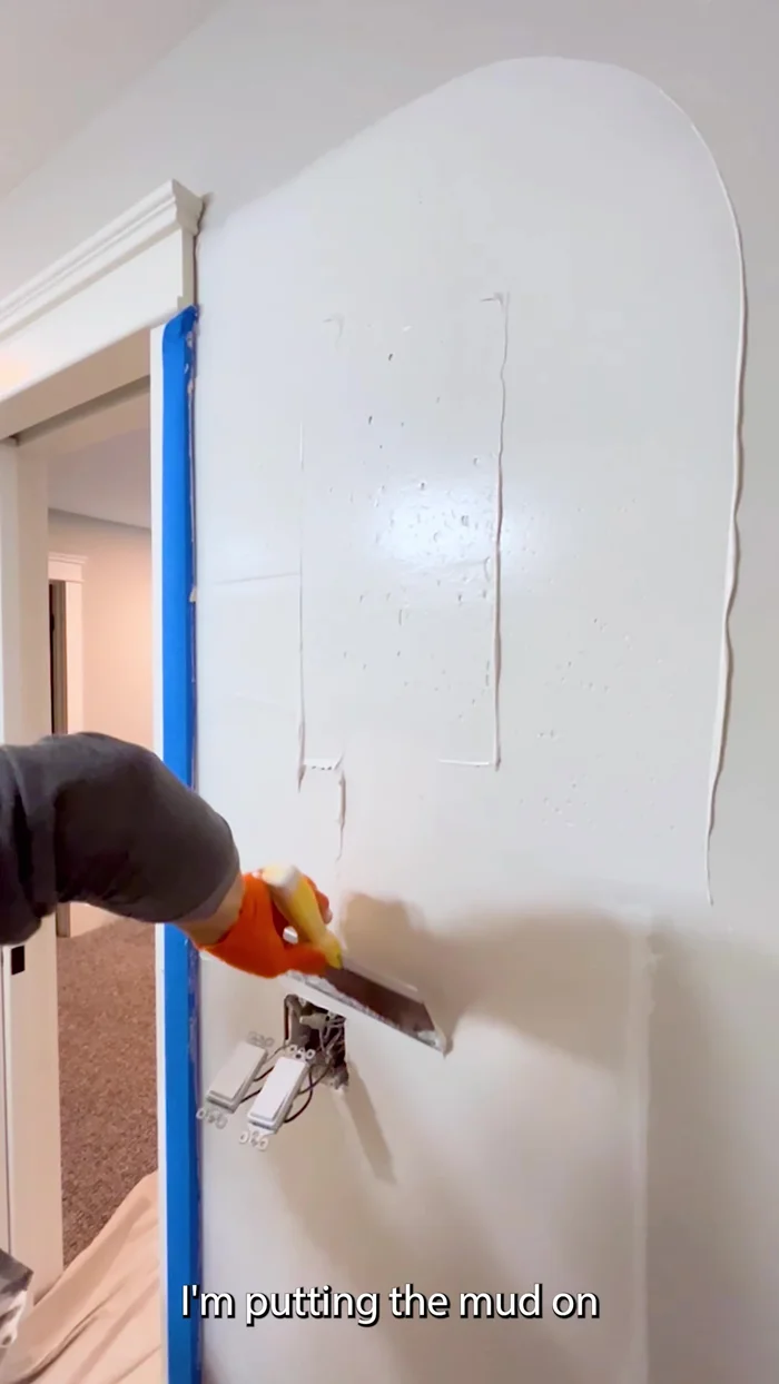 Final smoothing: Use a wider knife (14-inch is shown) for the final pass to create a smooth surface. This minimizes lap marks.