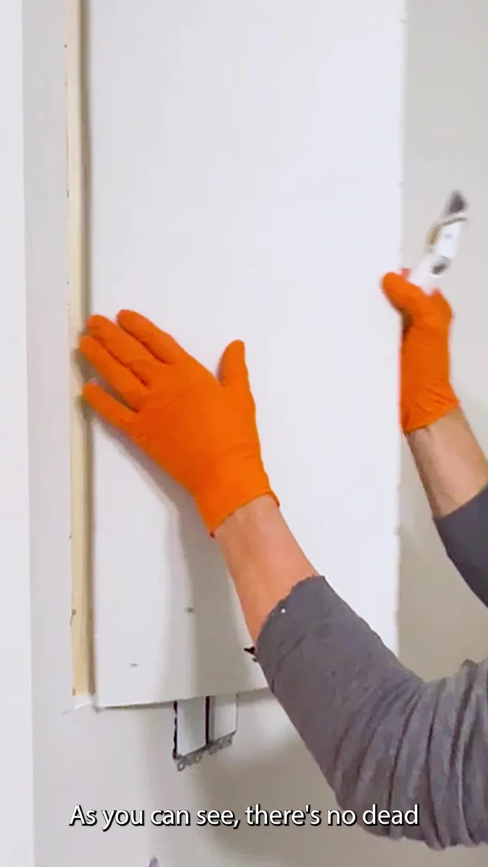 Prepare the edges of the damaged drywall by using a razor knife to cut the face paper at a 45-degree angle for a clean, smooth surface.