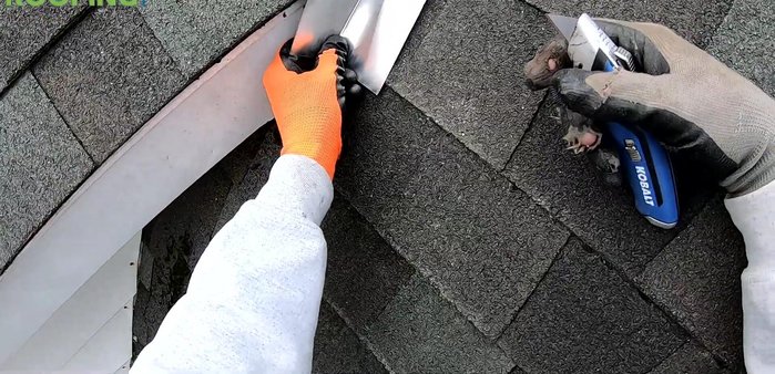 Use a piece of bent flat metal as a wedge to help lift and position the flashing.