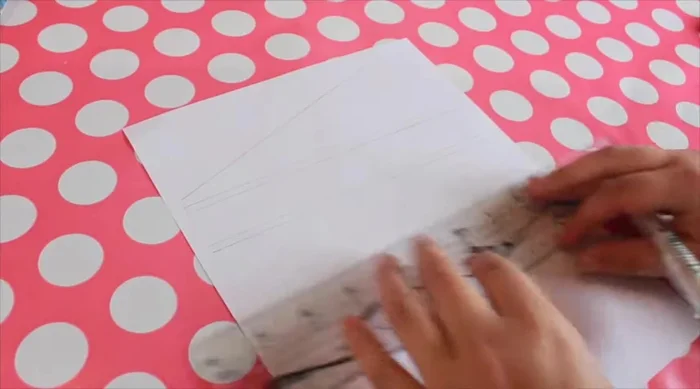 For the menu board (cookie sheet), remove tape from edges, carefully scoring where it meets the paint. Transfer and trace your design, then trace onto the chalkboard with the Sakura Solid Marker Slim.