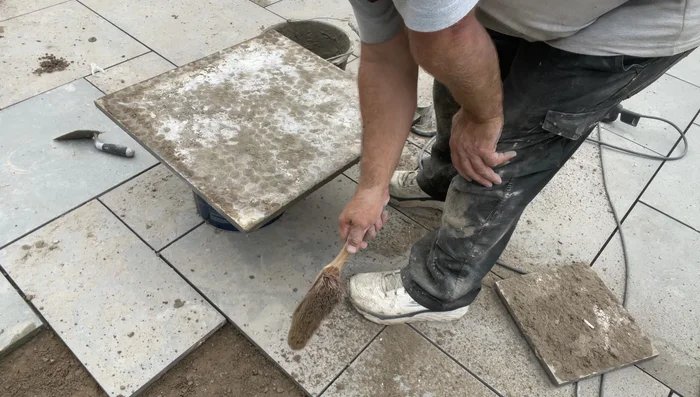 Apply a generous amount of professional prime and slurry to the back of the tile, ensuring a thick coat (approximately 2mm).