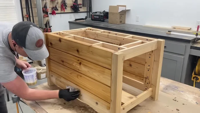 Apply several coats of outdoor oil to the cedar.