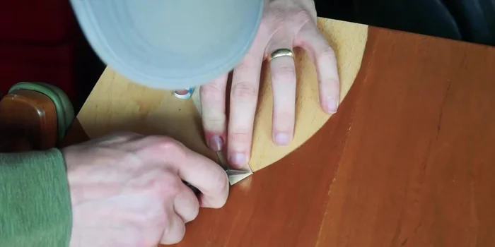 Cut iron-on veneer strips to fit the shape you've cut, creating a patchwork design.