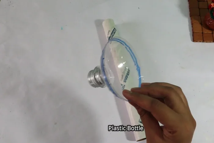Prepare the bottle piece: Sand the surface of the plastic bottle piece to ensure better adhesion of the wall putty.