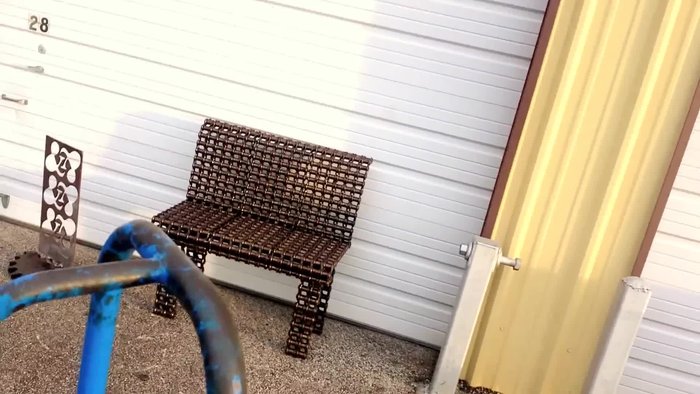 End table with saw blades, plow disc, and rebar