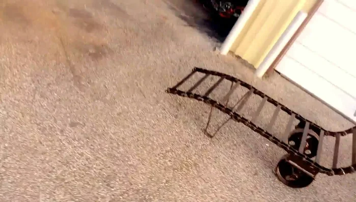 End table with saw blades, plow disc, and rebar