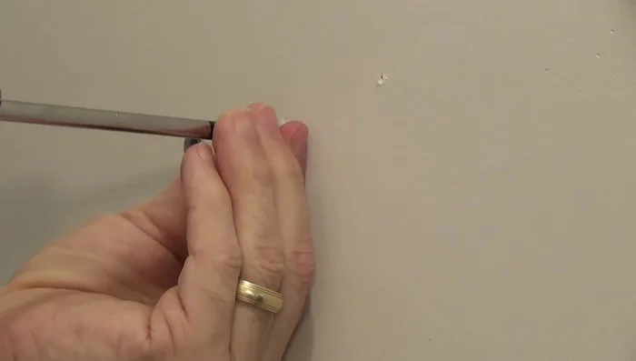 For drywall: Use pliers to pull the anchor out.