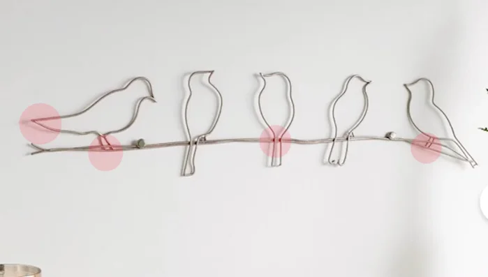 Shape the birds: Use pliers to shape the wire according to the bird's form, creating curves and details. Use masking tape to hold the wire in place while shaping.