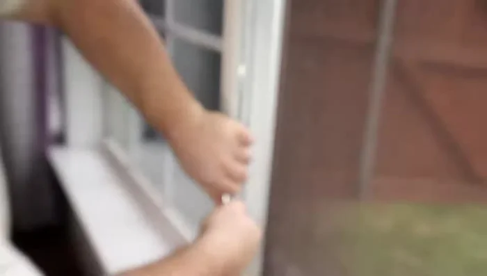 Using the appropriate tool (as shown in the video), insert the new spring from the *outside* of the window frame and turn it clockwise about 10 times to secure it.