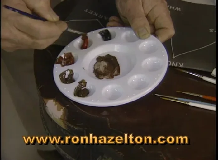 Mix artist acrylic colors to match the wood's color. Apply multiple layers until the desired color is achieved.