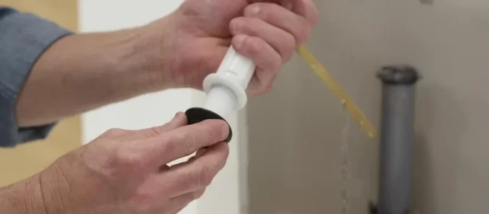 Reattach the supply line nut, and attach the fill valve tube to the overflow tube. Turn the water supply back on.