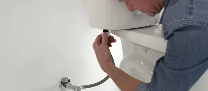 Reattach the supply line nut, and attach the fill valve tube to the overflow tube. Turn the water supply back on.