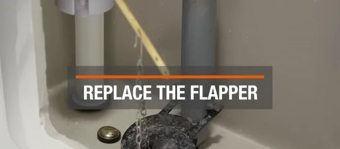 Adjust the chain length as needed, and replace the toilet tank lid.