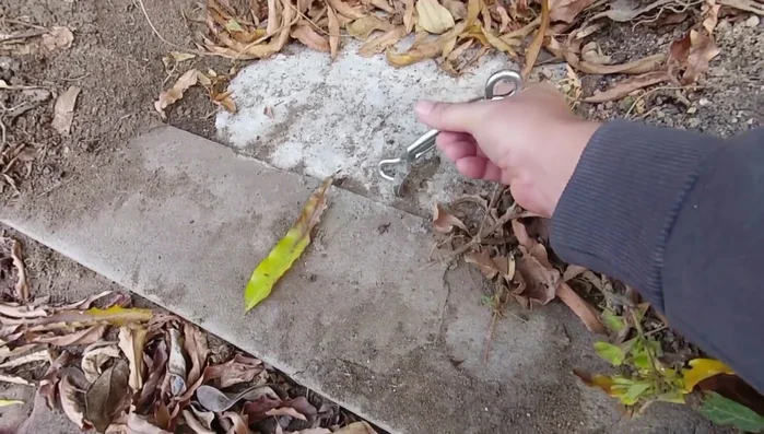 Attach the metal cable to the sling and posts.