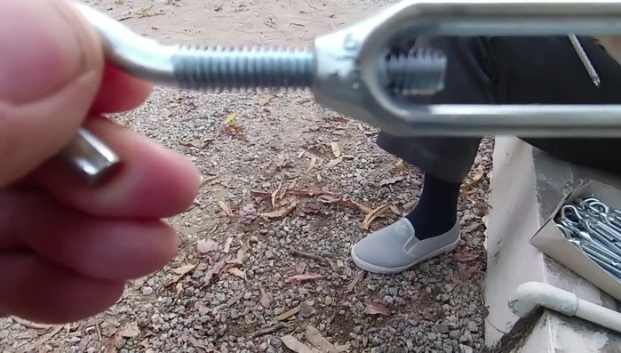 Continue tightening the cable until the wall is straight.