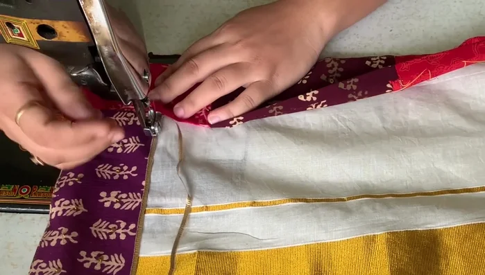 Finish the corners: The video shows a technique for neatly finishing the saree corners with the gota, avoiding pleats and maintaining clean stitching.