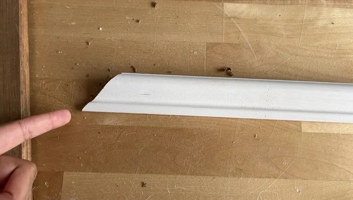 Tape Trim to Wall for Accuracy: