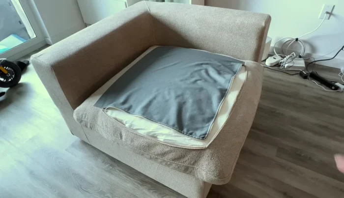 Zipping up the cushion covers.