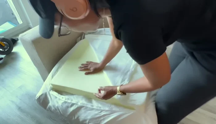 Zipping up the cushion covers.