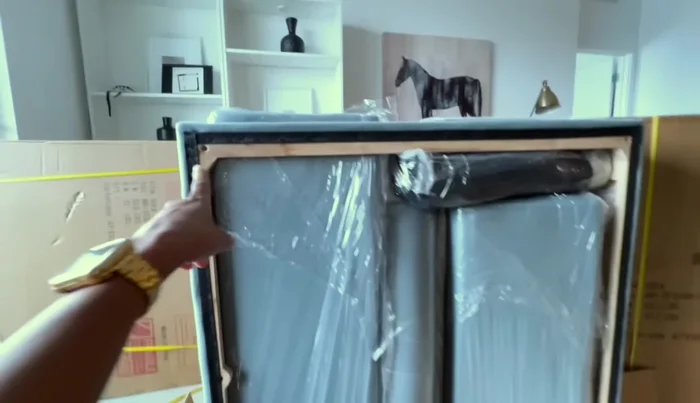 Inspecting the internal construction of the base, seat cushions, and armrests.