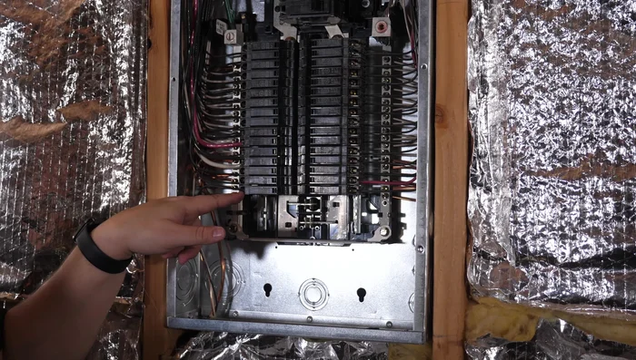 Release the breaker by pulling it forward. There's a clip holding it to the bar.