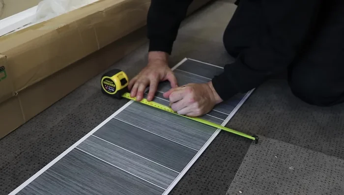 Use a straightedge and Stanley blade to cut the edge from top to bottom.