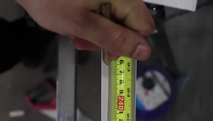 Drill 12mm countersunk screws into the trim edge at 300mm intervals.