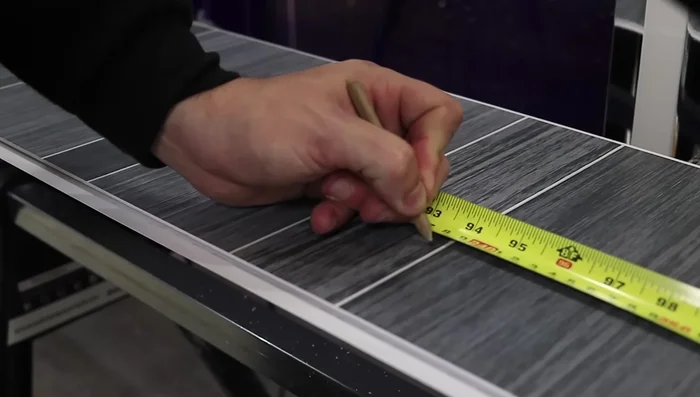 Apply silicone to the back of the panel (side to side if walls are uneven) and add it to the wall, pushing it into the internal trim.