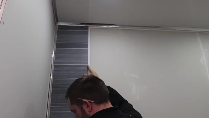 Use your drill to fix countersunk screws into the tongue of the panel.