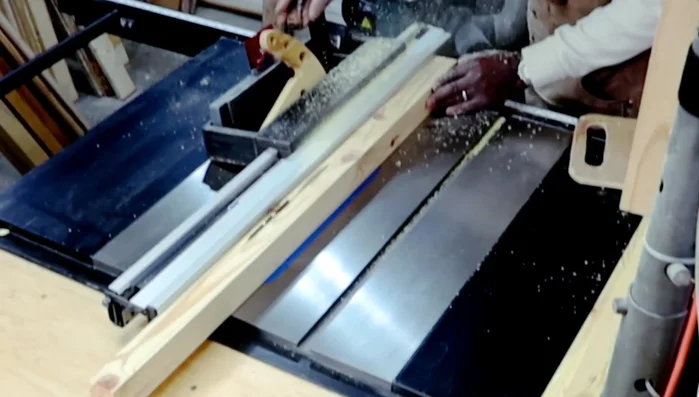 Laminating the face, back, and sides of the console table using additional pieces of wood, trimming the edges and light sanding.