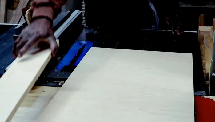 Laminating the face, back, and sides of the console table using additional pieces of wood, trimming the edges and light sanding.