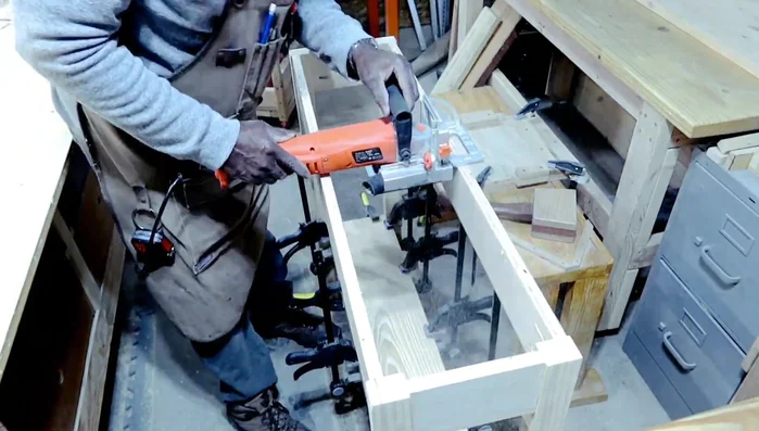 Creating and attaching hardwood hold downs for the tabletop.