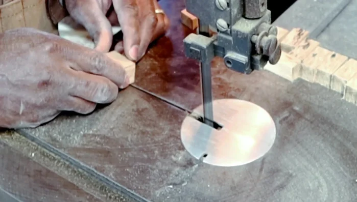 Creating and attaching hardwood hold downs for the tabletop.