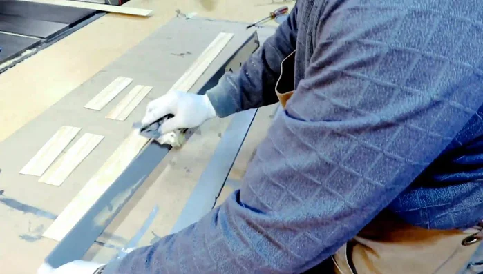 Attaching the laminate pieces with epoxy resin. Note: using too much epoxy can lead to excess squeeze-out.