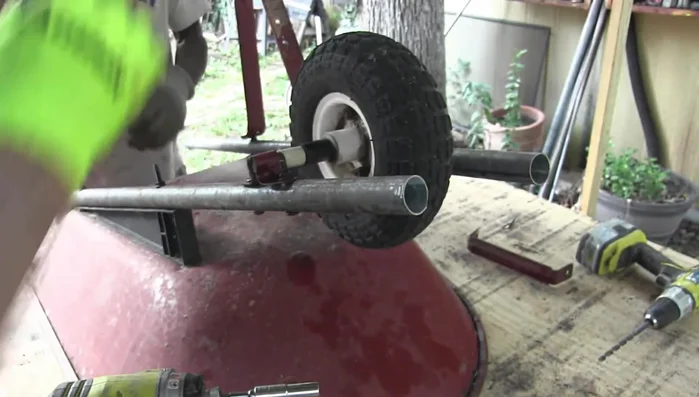 Attach the wheelbarrow brackets