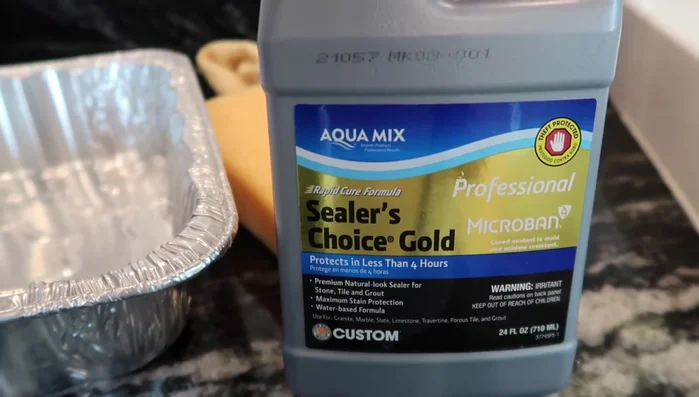 Apply the sealer (first coat): Apply the sealer evenly using a sponge (or paintbrush to avoid bubbles, as the video suggests). Let it sit for 30 minutes before applying a second coat, if needed.