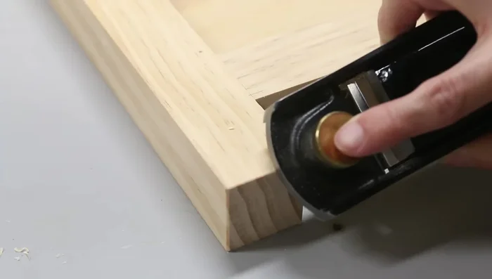 Sand and chamfer the bottom of legs.