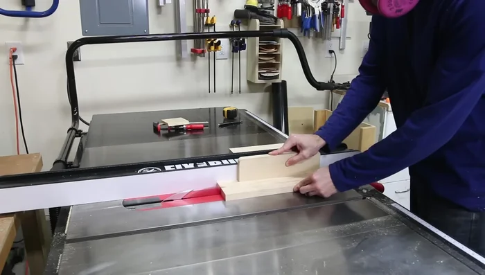 Attach side panels to the frame using pocket holes and shims (playing cards) to ensure flushness.