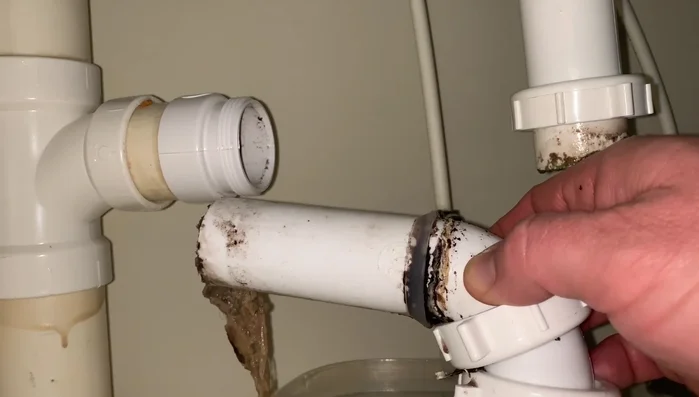 Reassemble the P-trap, ensuring the new washer is properly seated and the connections are tight but not over-tightened.