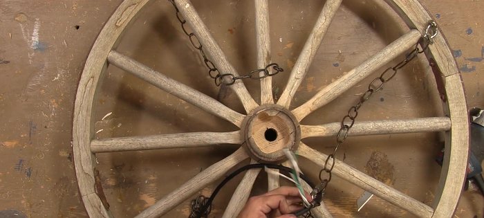 Cut wire lengths for each light (six total), drill holes in the junction box, pass wires through, and secure with wire staples.