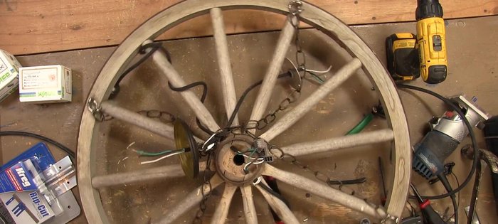 Cut wire lengths for each light (six total), drill holes in the junction box, pass wires through, and secure with wire staples.