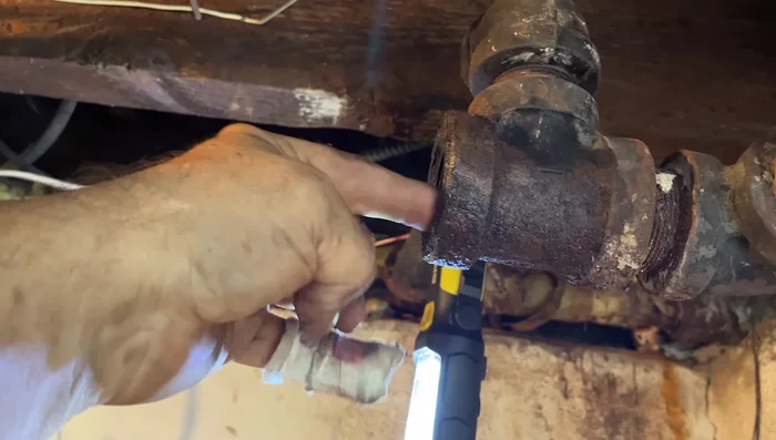 Measure and cut the replacement pipe: Measure the required length of the replacement pipe, adding extra for threading. Get the pipe cut and threaded at a hardware store.