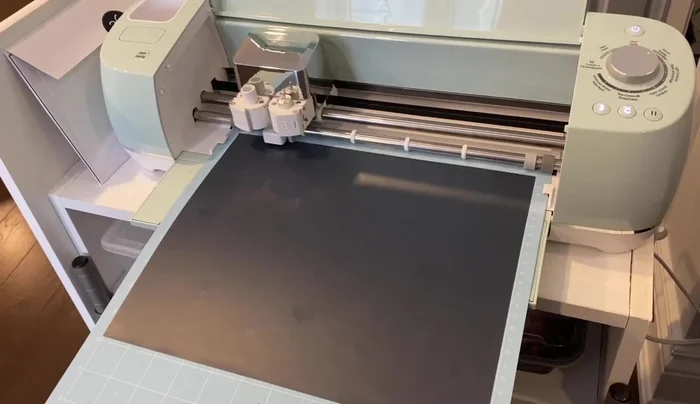 Attach the design to the tabletops using a heat press.