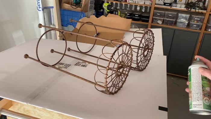 Paint the plant stands with flat black outdoor spray paint.