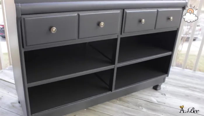 Clean the dresser with a microfiber towel and Windex.