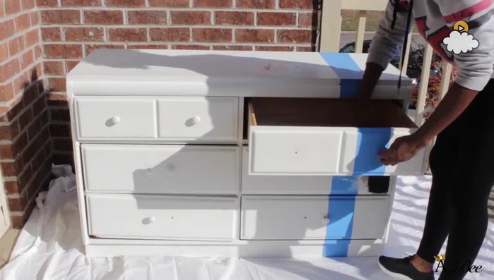 Remove drawer knobs and drawer slides.