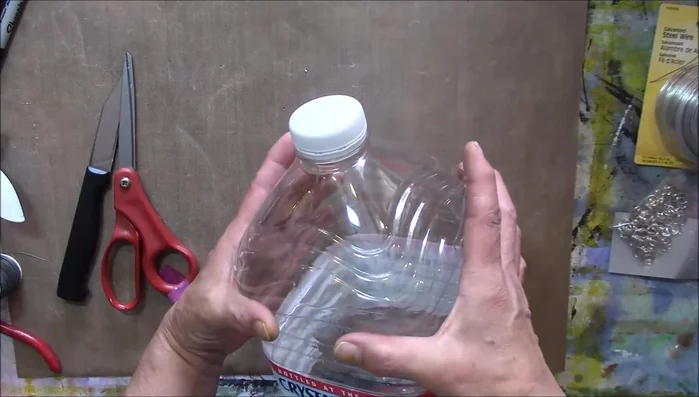 Add color to the water bottle top using alcohol inks (optional).